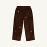 The Critter Sheffield Pants - Chelsea Chocolate Corduroy with Fox Embroidery by The Beaufort Bonnet Company are crafted from chocolate corduroy and feature an elastic waistband, a single back pocket, and charming fox embroidery with small green leaves scattered across the fabric.