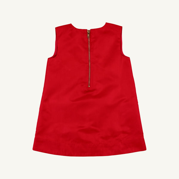 The Beaufort Bonnet Company’s Grandccasion™ Jilly Jumper in Richmond Red Taffeta, a sleeveless girls’ special occasion dress with an elegant design and a visible gold zipper on the back, is shown against a simple light background.
