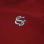 A close-up of The Beaufort Bonnet Company’s USC Hayword Half-Zip in South Carolina Garnet, showcasing a white interlocking SC logo embroidered in Worth Avenue White.