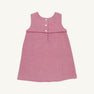 The Jill Jumper - Begley Berry Tweed by The Beaufort Bonnet Company is a sleeveless pink girls jumper dress featuring a textured pattern, an empire waistline, and three white buttons on the back. It is displayed laid flat on a plain white background.
