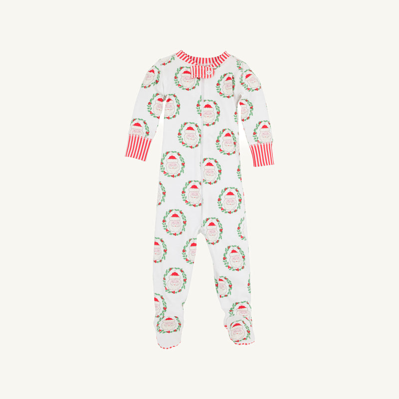 The Beaufort Bonnet Company’s Knox’s Night Night - North Pole Portrait with Richmond Red Stripe is a white baby onesie adorned with a cheerful pattern of red and green Santa Claus faces and wreaths, finished with red-and-white striped cuffs and collar, displayed on a plain background.