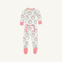 Introducing the Knox’s Night Night - North Pole Portrait with Richmond Red Stripe by The Beaufort Bonnet Company: a white baby onesie featuring festive Santa faces and wreaths, finished with vibrant red cuffs and feet. Cheerful red and white stripes accent the feet, while a small back flap in matching print adds an extra adorable detail.