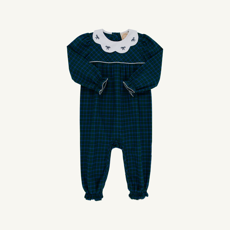The Beaufort Bonnet Company’s Long Sleeve Britt Romper in Woodlake Point Plaid with Worth Avenue White showcases a timeless dark green and blue plaid, complemented by a crisp white Peter Pan collar adorned with delicate blue bows. Charming ruffled edges at the cuffs and ankles add classic flair—making it a perfect piece for enhancing your little one’s autumn wardrobe.
