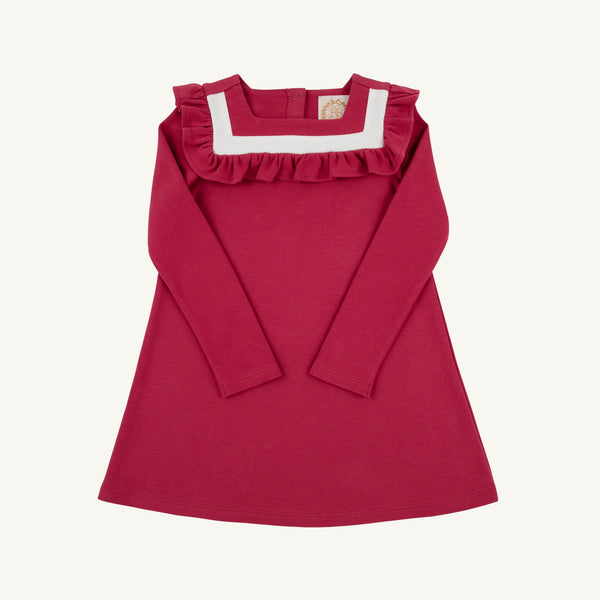 A children’s Long Sleeve Darla Dress by The Beaufort Bonnet Company, in the Begley Berry with Palmetto Pearl colorway, features an A-line silhouette with long sleeves, soft Pima Cotton Knit fabric, a white square neckline, and ruffle trim detail on the chest—shown laid flat on a light background and perfect for autumn.