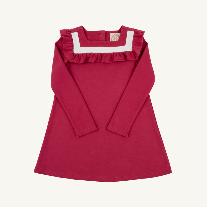 A children’s Long Sleeve Darla Dress by The Beaufort Bonnet Company, in the Begley Berry with Palmetto Pearl colorway, features an A-line silhouette with long sleeves, soft Pima Cotton Knit fabric, a white square neckline, and ruffle trim detail on the chest—shown laid flat on a light background and perfect for autumn.