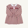 The Beaufort Bonnet Company’s Long Sleeve Mary Dal Dress - Easton Pond Plaid with Worth Avenue White features red and beige plaid, a classic white Peter Pan collar, smocked chest, and delicate red embroidered bow detail on the front—making it the perfect autumn dress for girls.