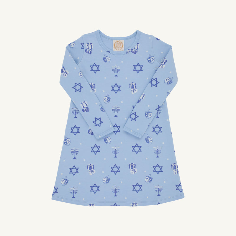 The Beaufort Bonnet Company’s Long Sleeve Polly Play Dress - Eight Nights to Remember is a light blue Hanukkah dress adorned with festive prints of Stars of David, menorahs, dreidels, and gelt coins throughout. Made from soft Pima cotton, the dress features long sleeves and is shown laid flat on a white background.