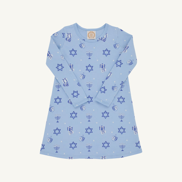 The Beaufort Bonnet Company’s Long Sleeve Polly Play Dress - Eight Nights to Remember is a light blue Hanukkah dress adorned with festive prints of Stars of David, menorahs, dreidels, and gelt coins throughout. Made from soft Pima cotton, the dress features long sleeves and is shown laid flat on a white background.