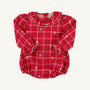 The Long Sleeve Ramona Ruffle Bubble in Torrington Tartan with Palmetto Pearl by The Beaufort Bonnet Company features long sleeves, a ruffled collar, elastic cuffs, and charming small white bow patterns. This classic and festive bubble is perfect for holidays or special occasions.