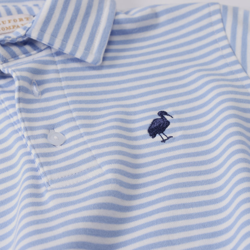 Long Sleeve Prim & Proper Polo in Park City Periwinkle Stripe with Nantucket Navy, a Pima cotton shirt with white and light blue horizontal stripes and a dark blue bird logo embroidered on the chest.