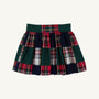 The McPrimm Party Skirt - Mercer Island Madras is a pleated mini skirt featuring a patchwork pattern of dark green, navy blue, and red and white plaid.