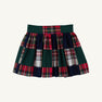 The McPrimm Party Skirt - Mercer Island Madras is a pleated mini skirt featuring a patchwork pattern of dark green, navy blue, and red and white plaid.