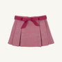 The Parson Pleated Skirt in Begley Berry Tweed by The Beaufort Bonnet Company features a pink textured pattern with elegant pleats and a coordinating pink waistband tied in a bow at the front. Shown against a plain white background, it’s the perfect fall skirt for girls.