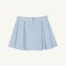 The Parson Pleated Skirt in Buckhead Blue Corduroy by The Beaufort Bonnet Company is a light blue corduroy mini skirt featuring pleats, a front zipper, and a waistband, displayed against a plain white background.