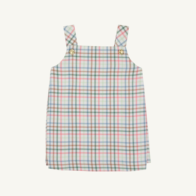 The Beaufort Bonnet Company’s Pleated Ginny Jumper in Manalapan Plaid features an A-line, sleeveless silhouette with shoulder straps and gold buttons, showcasing a pastel pink, blue, and green plaid—perfect for fall styling and displayed on a simple background.