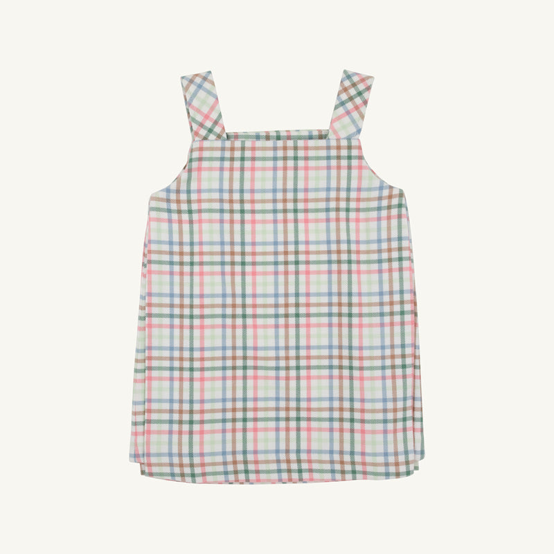 The Beaufort Bonnet Company’s Pleated Ginny Jumper in Manalapan Plaid, a sleeveless dress with thick shoulder straps featuring a pastel pink, green, blue, and white plaid pattern, is displayed laid flat on a plain background.