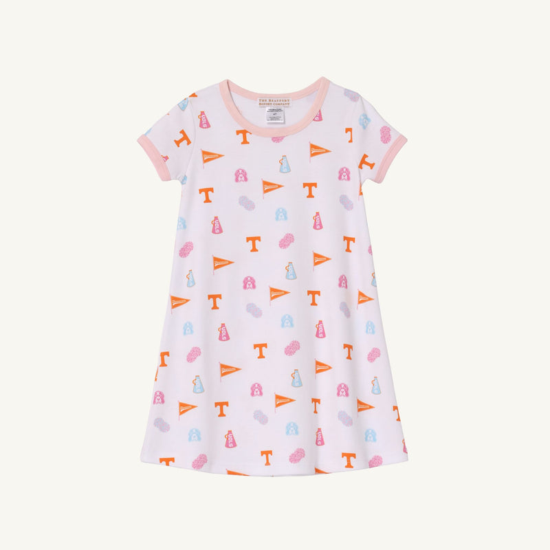 Introducing the Tennessee Polly Play Dress - Victory in Orange with Palm Beach Pink by The Beaufort Bonnet Company: a short-sleeved, white dress crafted from soft Pima Cotton Knit, featuring peach trim and decorated with repeating orange flags, pink and blue icons, and orange T letters for a winning look.