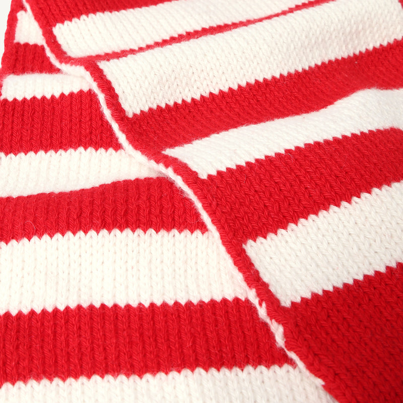 Close-up of The Beaufort Bonnet Company’s Seller’s Scarf in Richmond Red & Palmetto Pearl Stripe, showcasing its knit texture and bold red-and-white horizontal stripes. The cotton knit scarf is neatly folded, displaying a prominent seam along the center.