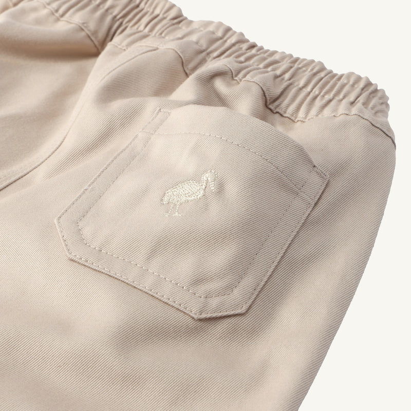 Sheffield Pants in Keeneland Khaki, crafted in cotton twill with an elastic waistband and a back pocket featuring an embroidered stork.