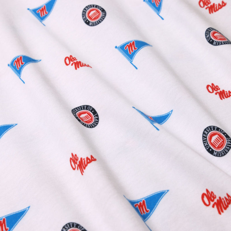 Crafted from white Pima cotton, the Ole Miss Short Sleeve Patton Play Bubble - Gawsh Almighty with Nantucket Navy by The Beaufort Bonnet Company features a repeating design of blue pennants, red “Ole Miss” text, and round University of Mississippi logos in red and white across the fabric.
