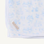 The Sir Proper’s Sweet Arrival (Beale Street Blue) Accessories Bundle by The Beaufort Bonnet Company includes a baby buggy blanket made from white Pima cotton, adorned with light blue animal and nature illustrations and finished with a corner sewn label featuring THE BEAUFORT BONNET COMPANY in gold lettering—an ideal choice for baby shower gifts or adding to your baby registry.