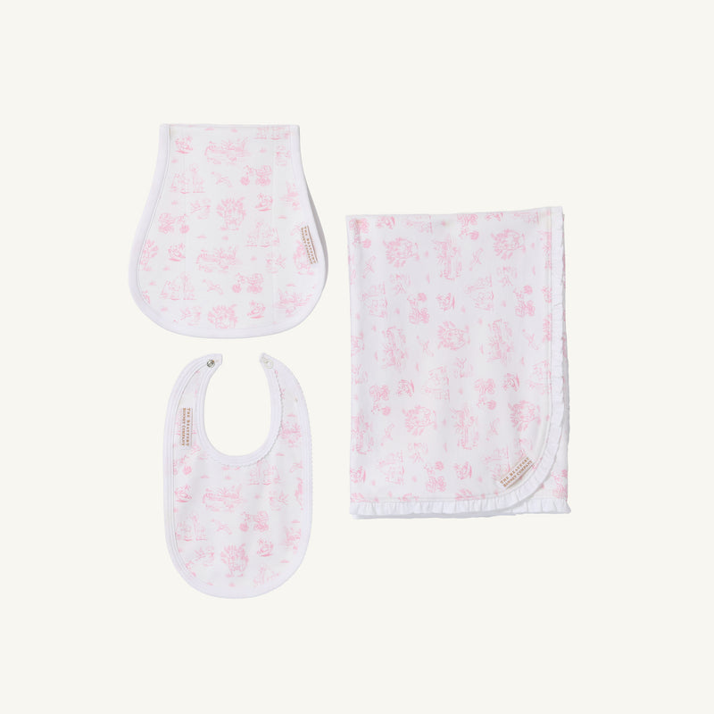 Introducing Sir Proper’s Sweet Arrival (Hamptons Hot Pink) Accessories Bundle by The Beaufort Bonnet Company—a delightful set featuring a Baby Buggy Blanket with a ruffled edge, an Oopsie Daisy Burp Cloth, and a Burp Me Bib. Each item is crafted in crisp white adorned with light pink Hamptons Hot Pink patterns. Beautifully arranged on a plain white background, this charming trio makes the perfect baby shower gift.
