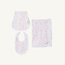 Introducing Sir Proper’s Sweet Arrival (Hamptons Hot Pink) Accessories Bundle by The Beaufort Bonnet Company—a delightful set featuring a Baby Buggy Blanket with a ruffled edge, an Oopsie Daisy Burp Cloth, and a Burp Me Bib. Each item is crafted in crisp white adorned with light pink Hamptons Hot Pink patterns. Beautifully arranged on a plain white background, this charming trio makes the perfect baby shower gift.
