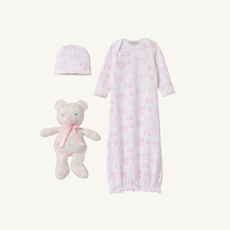 Introducing Sir Proper’s Sweet Arrival (Hamptons Hot Pink) Bundle by The Beaufort Bonnet Company—a delightful newborn set featuring a Pima cotton layette, including a baby gown, matching hat, and the cuddly Bradley Bear. This charming ensemble comes in crisp white with light pink animal prints and is beautifully presented on a plain white background—making it an ideal baby shower gift.