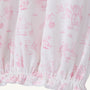 The Sir Proper’s Sweet Arrival (Hamptons Hot Pink) Bundle - Adorable Everyday Set & Bradley Bear by The Beaufort Bonnet Company features soft white Pima cotton adorned with pink illustrations of animals, trees, and children at play, and is gathered with elastic at the bottom hem—making it a perfect baby shower gift.