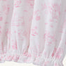 The Sir Proper’s Sweet Arrival (Hamptons Hot Pink) Bundle - Adorable Everyday Set & Bradley Bear by The Beaufort Bonnet Company features soft white Pima cotton adorned with pink illustrations of animals, trees, and children at play, and is gathered with elastic at the bottom hem—making it a perfect baby shower gift.