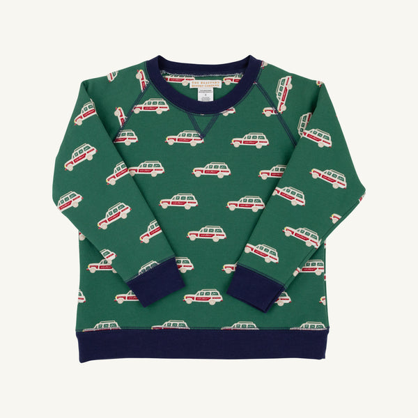 The Smitty Sweatshirt - Windsor Wagon (Grier Green) with Nantucket Navy by The Beaufort Bonnet Company is a green boys’ sweatshirt adorned with a red and white station wagon pattern, featuring navy blue collar, cuffs, and hem, plus a cozy fleece interior. The sweatshirt is shown laid flat on a white background.