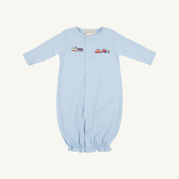 Introducing the Twinkle Twinkle 2-in-1—Buckhead Blue with Trains by The Beaufort Bonnet Company. Crafted from soft Pima cotton, this charming layette features a light blue hue, long sleeves, front snap buttons, and an elasticized bottom for easy changing. A delicate embroidered train motif spans the chest, adding a touch of classic charm. Perfect for your little one—all set against a plain white background.