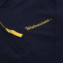 A close-up of The Beaufort Bonnet Company’s Michigan Hayword Half-Zip in Michigan Blue with a Michigan Yellow zipper, featuring “Wolverines” embroidered in yellow script above the pocket.