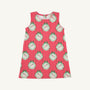 The Annie Apron Dress - Distinguished Doggies with Hamptons Hot Pink is a sleeveless A-line dress in red and white vertical stripes, featuring a repeating print of puppies inside scalloped, green-bowed frames.