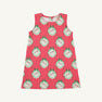 The Annie Apron Dress - Distinguished Doggies with Hamptons Hot Pink is a sleeveless A-line dress in red and white vertical stripes, featuring a repeating print of puppies inside scalloped, green-bowed frames.