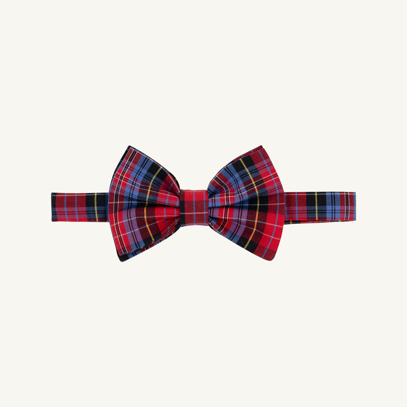 The Beaufort Bonnet Company’s Baylor Bowtie - Bucktown Tartan features a red plaid design with blue, yellow, and Bucktown Tartan stripes on a matching band. Displayed against an off-white background, this bowtie offers an adjustable fit.