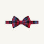 The Beaufort Bonnet Company’s Baylor Bowtie - Bucktown Tartan features a red plaid design with blue, yellow, and Bucktown Tartan stripes on a matching band. Displayed against an off-white background, this bowtie offers an adjustable fit.