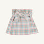 The Beasley Bow Skirt - Manalapan Plaid by The Beaufort Bonnet Company is a short skirt with a pastel plaid pattern, featuring a wide waistband and a large bow tied at the front.