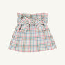 The Beasley Bow Skirt - Manalapan Plaid by The Beaufort Bonnet Company is a short skirt with a pastel plaid pattern, featuring a wide waistband and a large bow tied at the front.