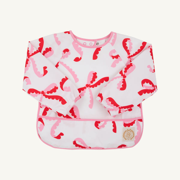 Long-sleeved Biscuit Bib - Bonnie Scot Bows with Hamptons Hot Pink, featuring a pink and red bow pattern with pink trim.