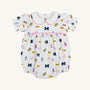 Dress your little one in The Beaufort Bonnet Company’s Michigan Britt Bubble – Bold in Blue with Hamptons Hot Pink. This white baby romper features charming puff sleeves, a Peter Pan collar, and pink trim. The playful pattern showcases blue M logos, yellow flags, blue and pink pom-poms, and megaphones. Made from soft Pima Cotton Knit with a gathered waist, it’s perfect for young fans who love to be bold in blue!.