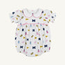 Dress your little one in The Beaufort Bonnet Company’s Michigan Britt Bubble – Bold in Blue with Hamptons Hot Pink. This white baby romper features charming puff sleeves, a Peter Pan collar, and pink trim. The playful pattern showcases blue M logos, yellow flags, blue and pink pom-poms, and megaphones. Made from soft Pima Cotton Knit with a gathered waist, it’s perfect for young fans who love to be bold in blue!.