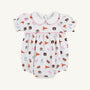 The Auburn Britt Bubble - Tiger Thrill with Hamptons Hot Pink by The Beaufort Bonnet Company is a white baby romper featuring puff sleeves, a Peter Pan collar, and a colorful Auburn University-themed Tiger Thrill print with pennants, pom-poms, hearts, and tiger mascots. Crafted from soft Pima Cotton Knit, it includes convenient snap closures at the bottom.