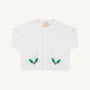 The Beaufort Bonnet Company’s Cambridge Cardigan in Worth Avenue White features long sleeves, front buttons, and festive green holly leaf with red berry designs near the bottom on each side. This cheerful baby sweater stands out against its plain light background, making it a perfect choice for the holiday season.