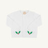The Beaufort Bonnet Company’s Cambridge Cardigan in Worth Avenue White features long sleeves, front buttons, and festive green holly leaf with red berry designs near the bottom on each side. This cheerful baby sweater stands out against its plain light background, making it a perfect choice for the holiday season.