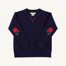 Navy blue Cassidy Comfy Crewneck - Nantucket Navy with Flowers featuring embroidered flower appliqués on each sleeve and red V-stitch detailing at the neckline.