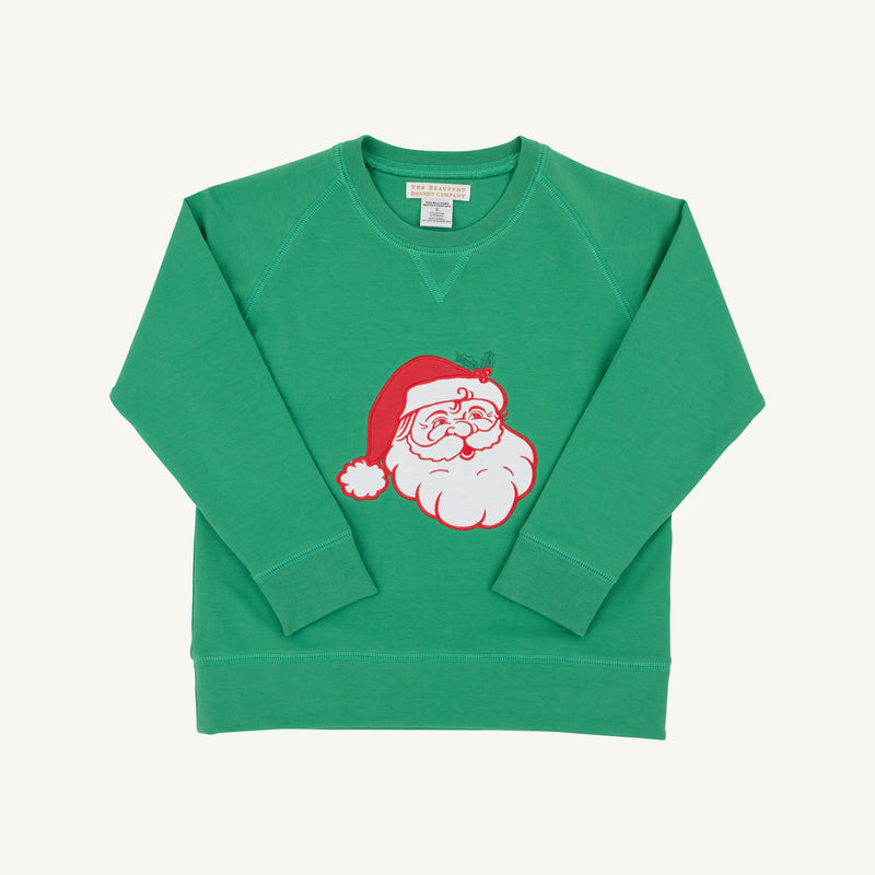 The Beaufort Bonnet Company’s Cassidy Comfy Crewneck in Kiawah Kelly Green features a cheerful Santa motif with Santa Claus wearing a red hat in the center, displayed on a plain white background—perfect for Christmas gatherings.