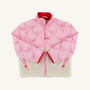 Introducing the Cate Coat - Bluffton Bows with Palmetto Pearl by The Beaufort Bonnet Company: a pink quilted girl’s coat adorned with embroidered bows outlined in red piping, finished with a red zipper and lining. The bottom half features cozy cream-colored sherpa fleece. Stylishly laid flat on a white background, this charming sherpa winter coat is perfect for keeping little ones warm on chilly days.