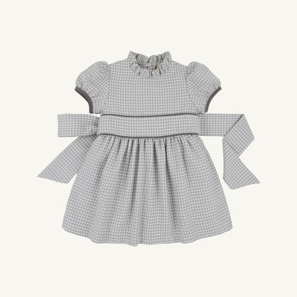 Cindy Lou Sash Dress - Grantley Gray Houndstooth featuring a ruffled collar, puff sleeves, and a back-tie sash.