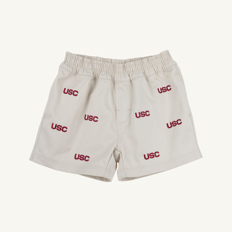 The Beaufort Bonnet Company’s South Carolina Critter Sheffield Shorts in Saratoga Stone feature an elastic waistband and multiple red USC logos embroidered across the front—perfect for showing your team spirit at the stadium.
